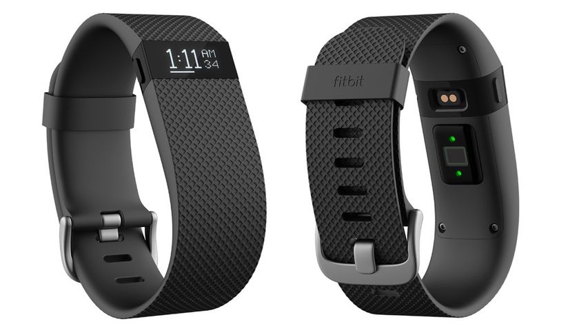 A Fitbit Charge fitness tracker displaying activity tracking features.