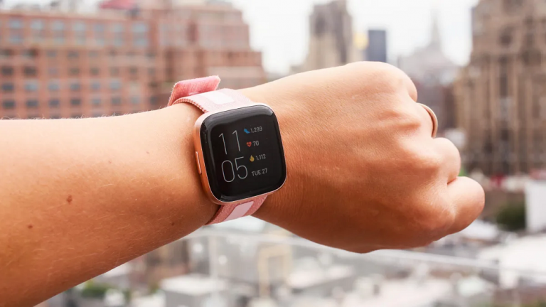 Fitbit smartwatch displaying fitness tracking features.