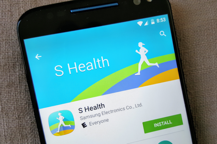 A smartphone with the Samsung Health app syncing data.