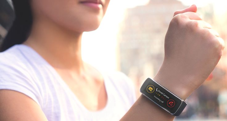 A person wearing a fitness tracker on their wrist.