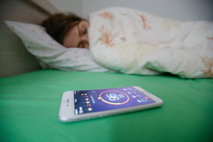 A sleep tracking app on a smartphone displaying sleep data.