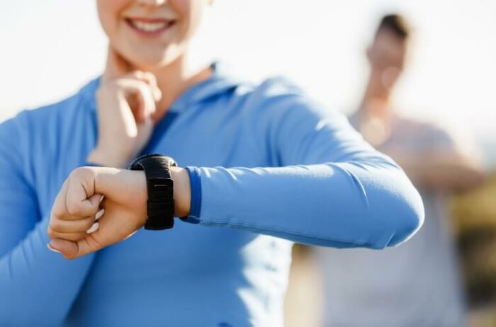 A person checking their resting heart rate using a fitness tracker.