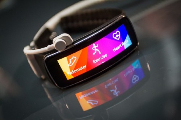 A Samsung smartwatch displaying heart rate tracking feature.