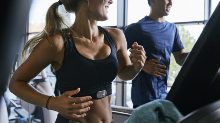 A person using a heart rate monitor to measure their heart rate.