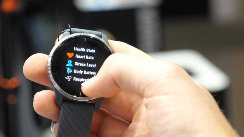 A close-up view of the Garmin Venu smartwatch with a vibrant AMOLED display and various fitness features.